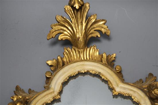 A pair of Italian giltwood cartouche shaped wall mirrors, width 25cm, height 43cm